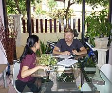 Trainer and trainee discussing progress